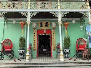 Ornate green facade of the Pinang Peranakan Mansion