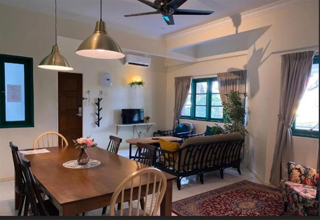 Open-plan dining and lounge area with pendant lights