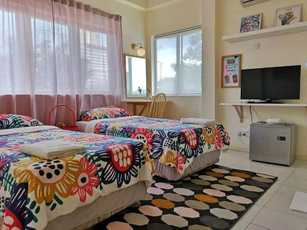 Twin beds with bright floral linens