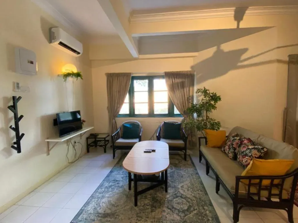 Lounge with sofa, armchairs and coffee table