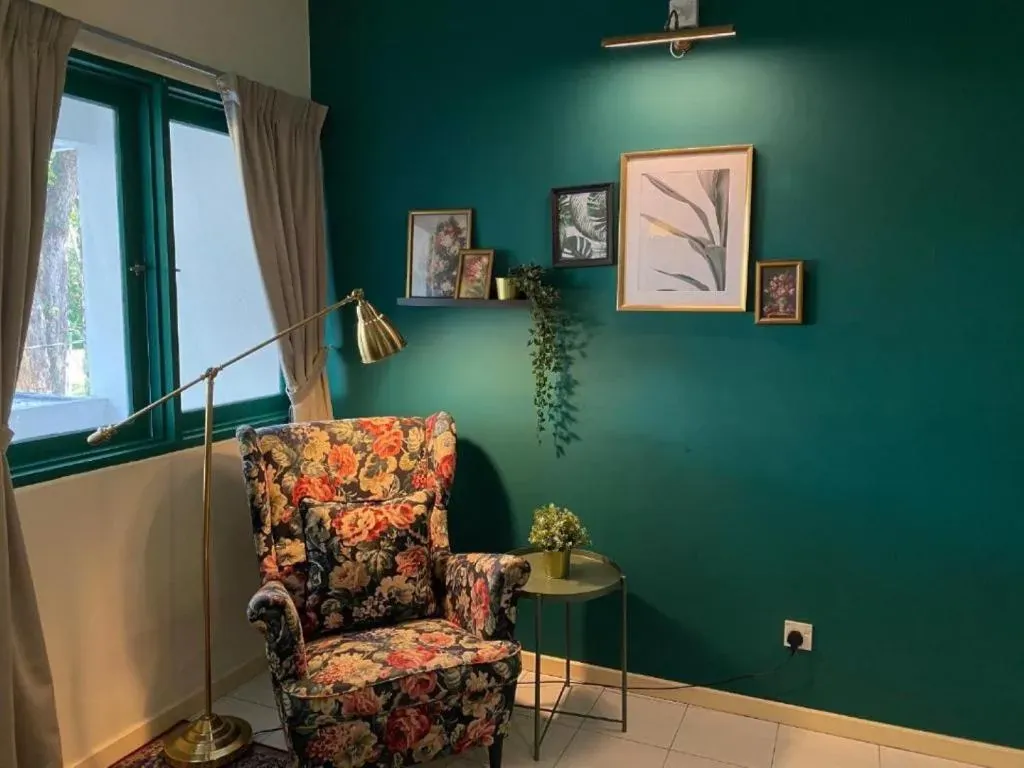 Floral armchair and reading lamp