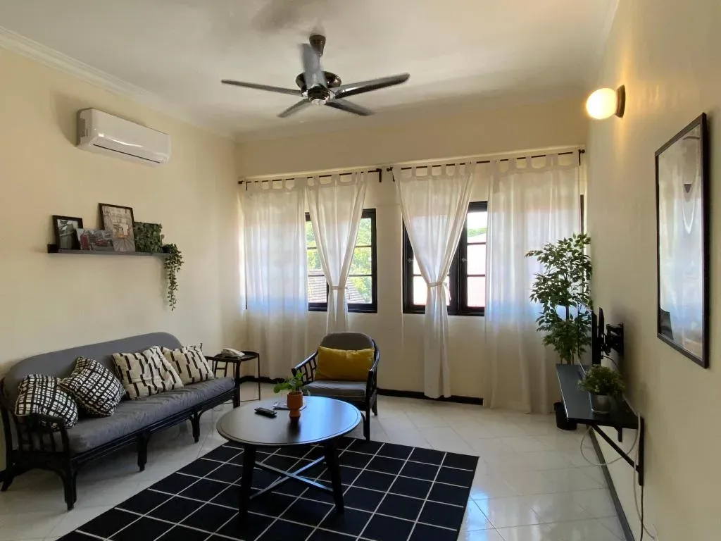 Bright lounge with sofa and sheer curtains