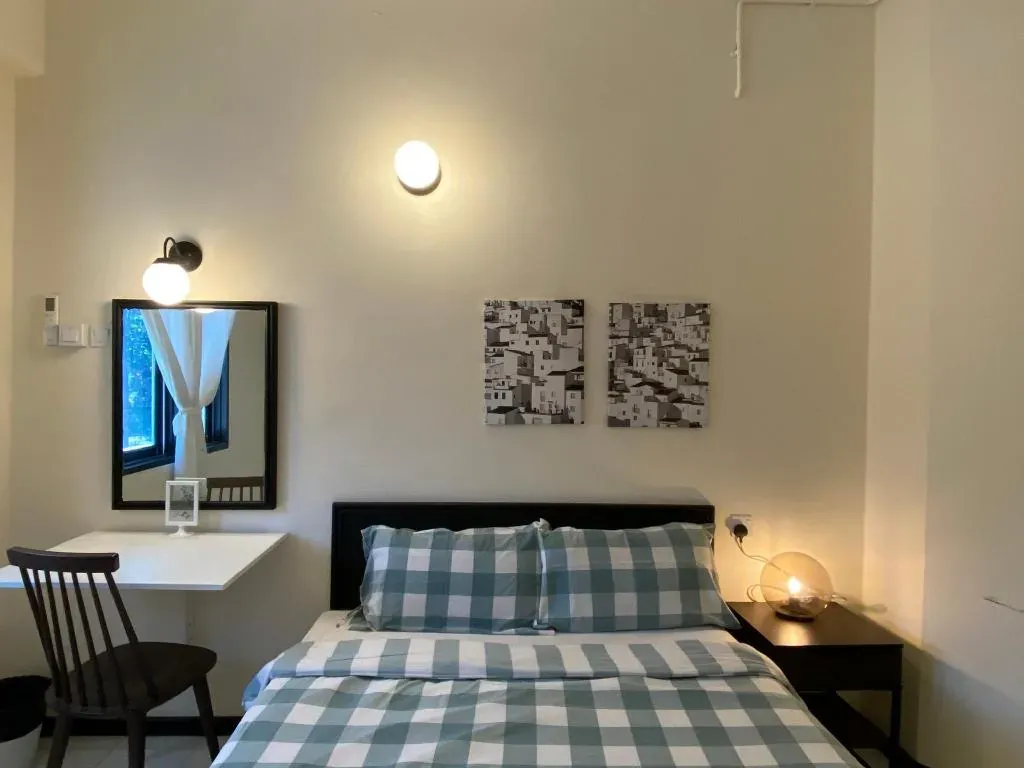 Queen bed and bedside lamp